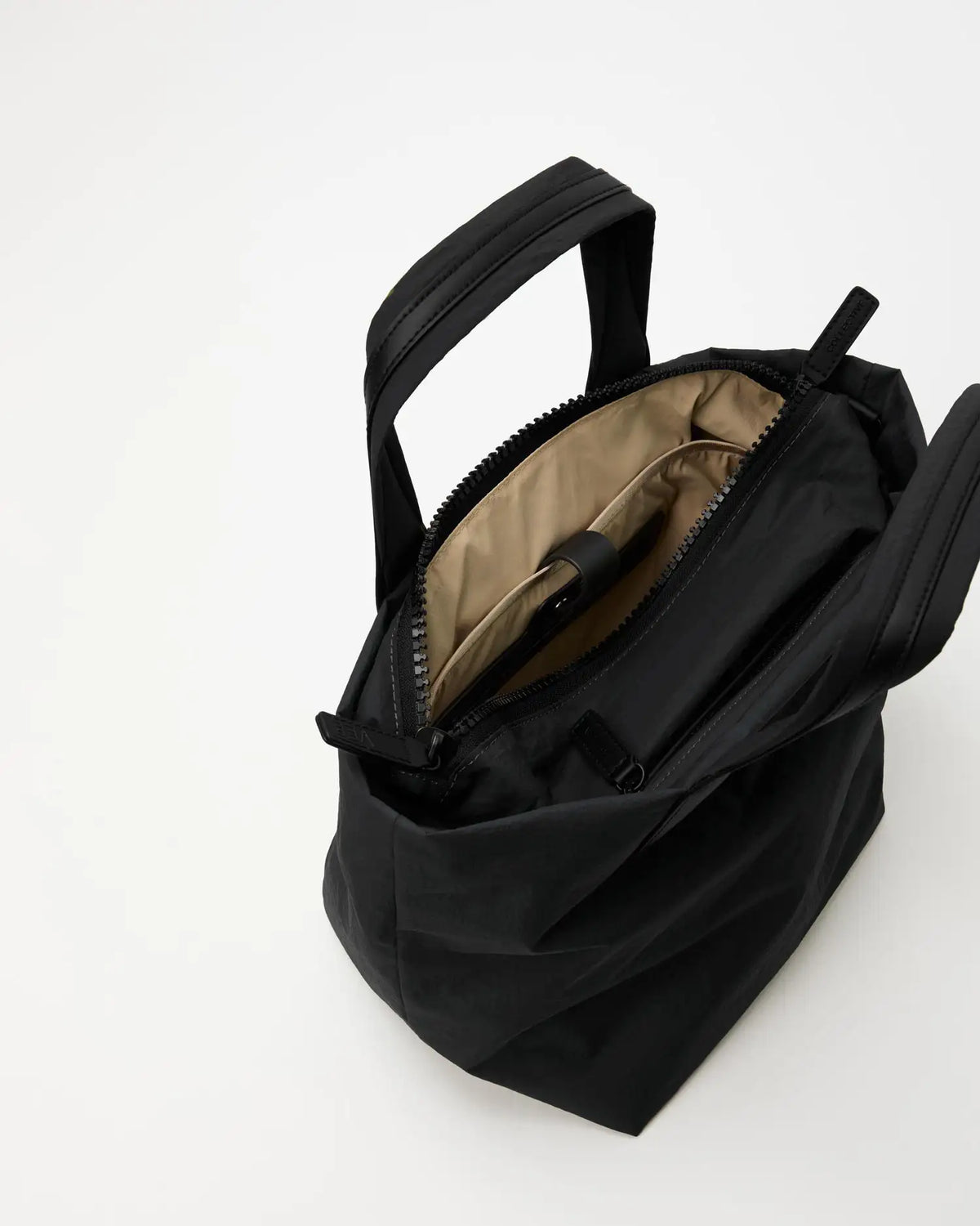 Porter Essence Small Black Paper bag with tan interior and compartments, crafted from sustainable paper touch nylon.