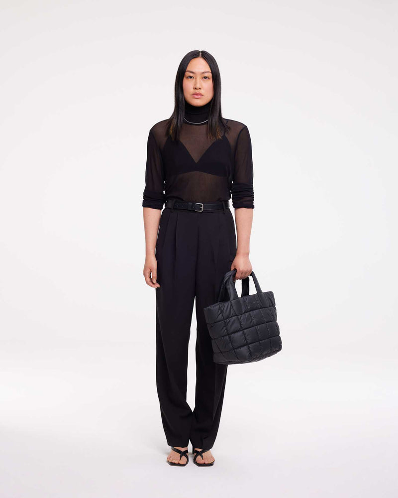 Small tote bag made from waterproof and sustainable materials, designed for versatility and durability. Ideal for work and everyday use, combining practical functionality with eco-friendly style in a compact design.