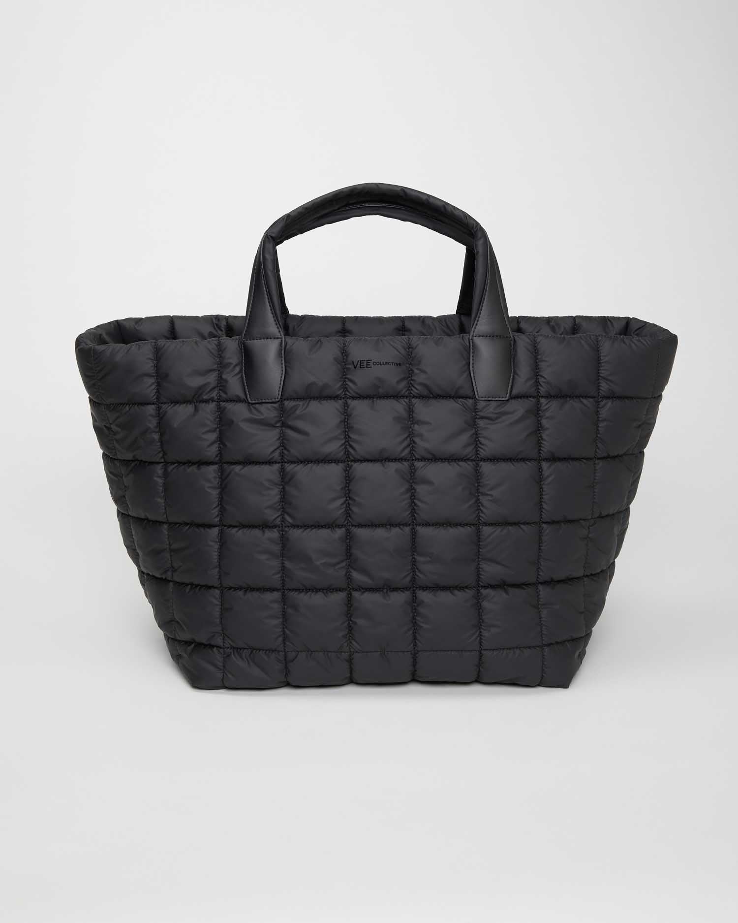 Black Weekender bag perfect for travel and carry-on use, lightweight and easy to carry. Features a vegan leather handle and is made from sustainable materials, combining eco-friendly design with practical functionality.