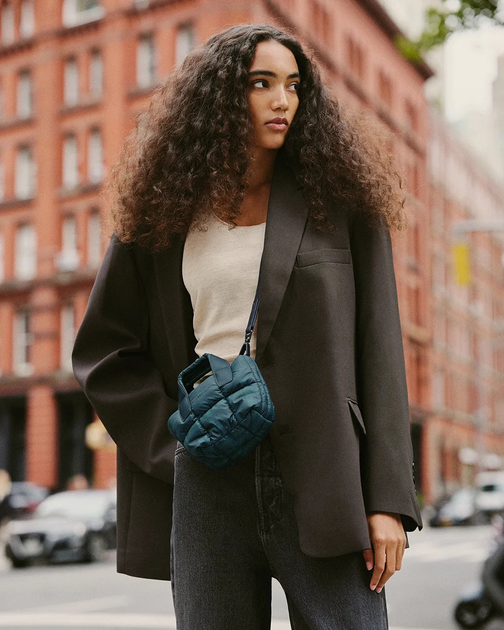 Street-style look featuring the VEE Porter Tote Micro in Ivy Plaid styled with a minimalist urban outfit.