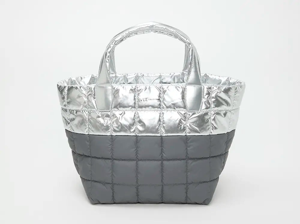 Silver quilted handbag on a white background