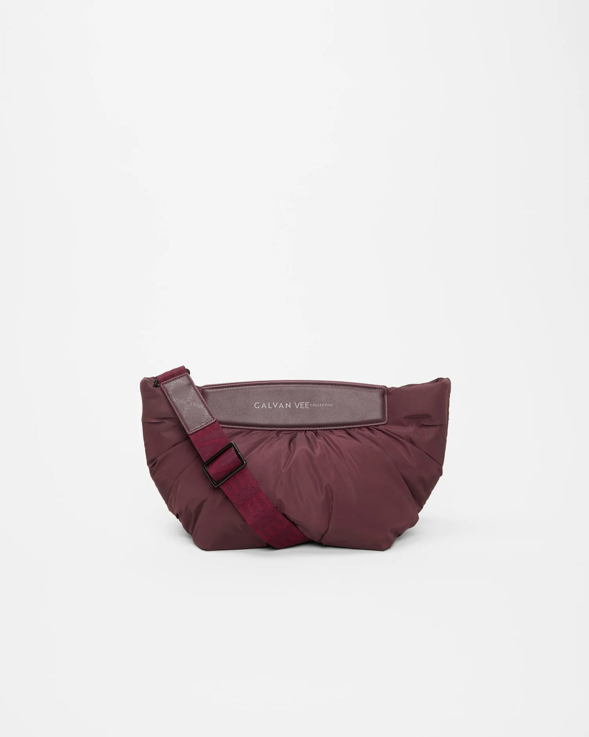 Front product shot of the Galvan x Vee Collective Caba Clutch Bag in mahogany, with part of the removable crossbody strap visible.