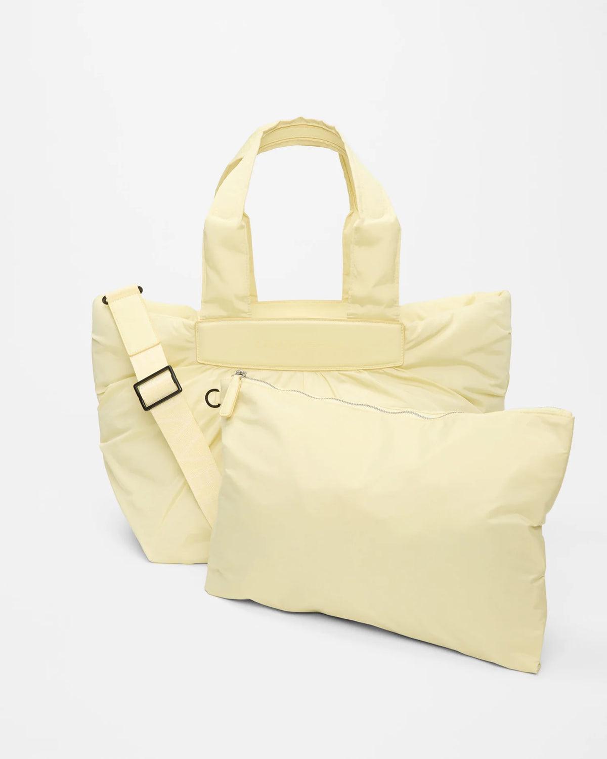 Product photo of the Galvan x Vee Collective Caba Medium Tote Bag in buttermilk, shown with its matching removable pouch placed in front of the bag.