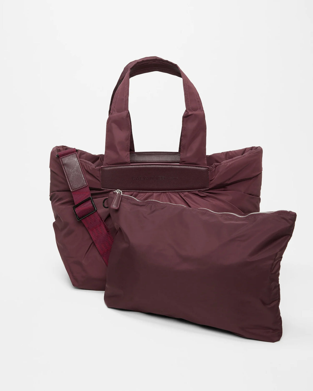 Product photo of the Galvan x Vee Collective Caba Medium Tote Bag in mahogany, shown with its matching removable pouch placed in front of the bag.