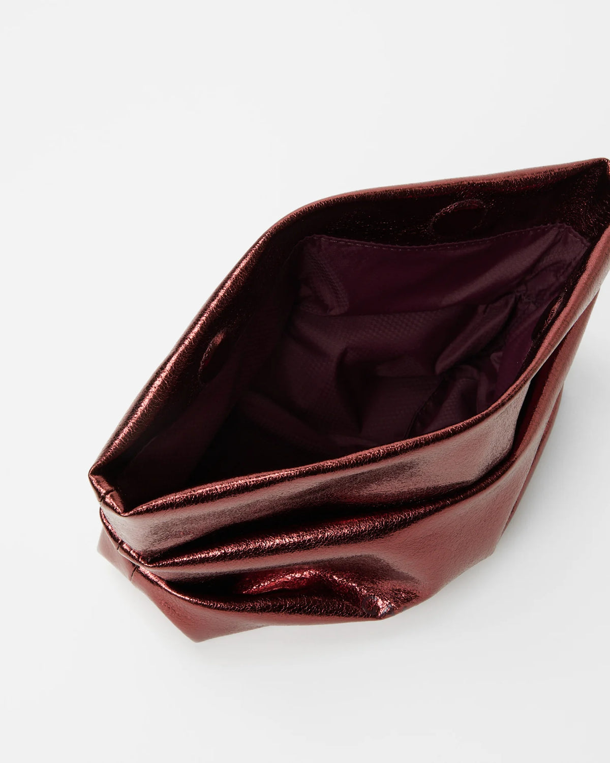 Angled, slightly overhead product photo of the Galvan x Vee Collective Evening Clutch Bag in mahogany metallic, shown open.