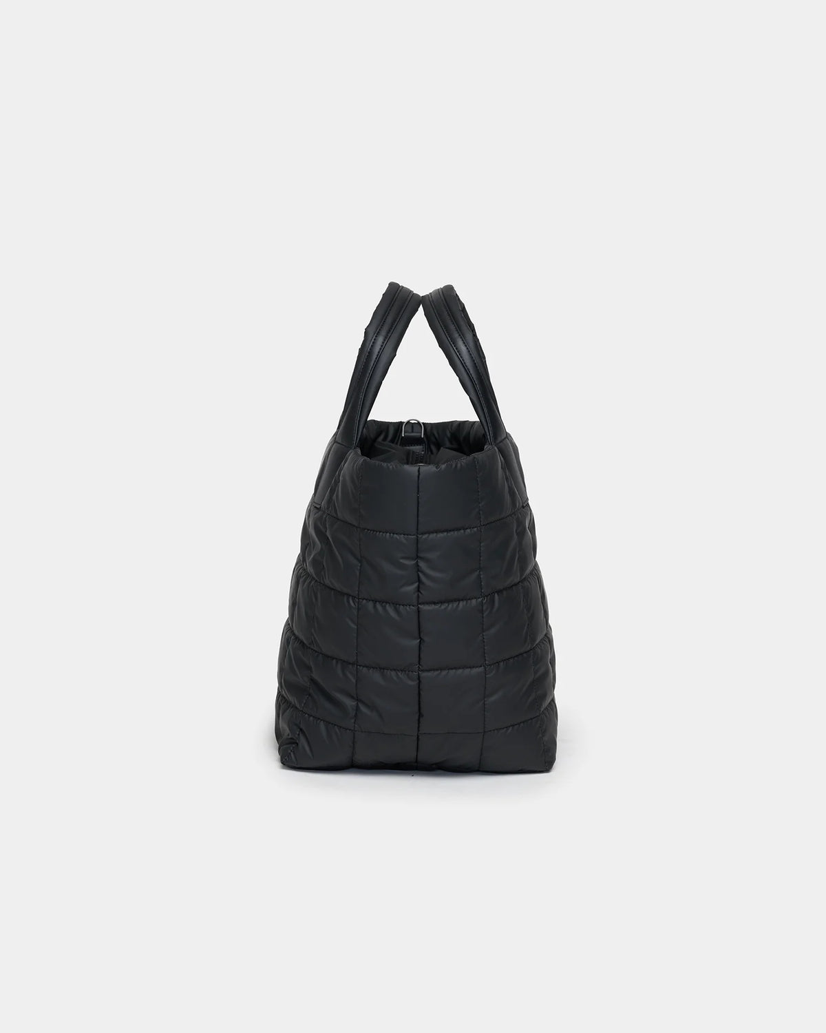 A black quilted tote bag with two sturdy handles is displayed against a plain background. The bag features a soft, padded texture and a spacious opening, making it ideal for everyday use and versatile for various occasions.
