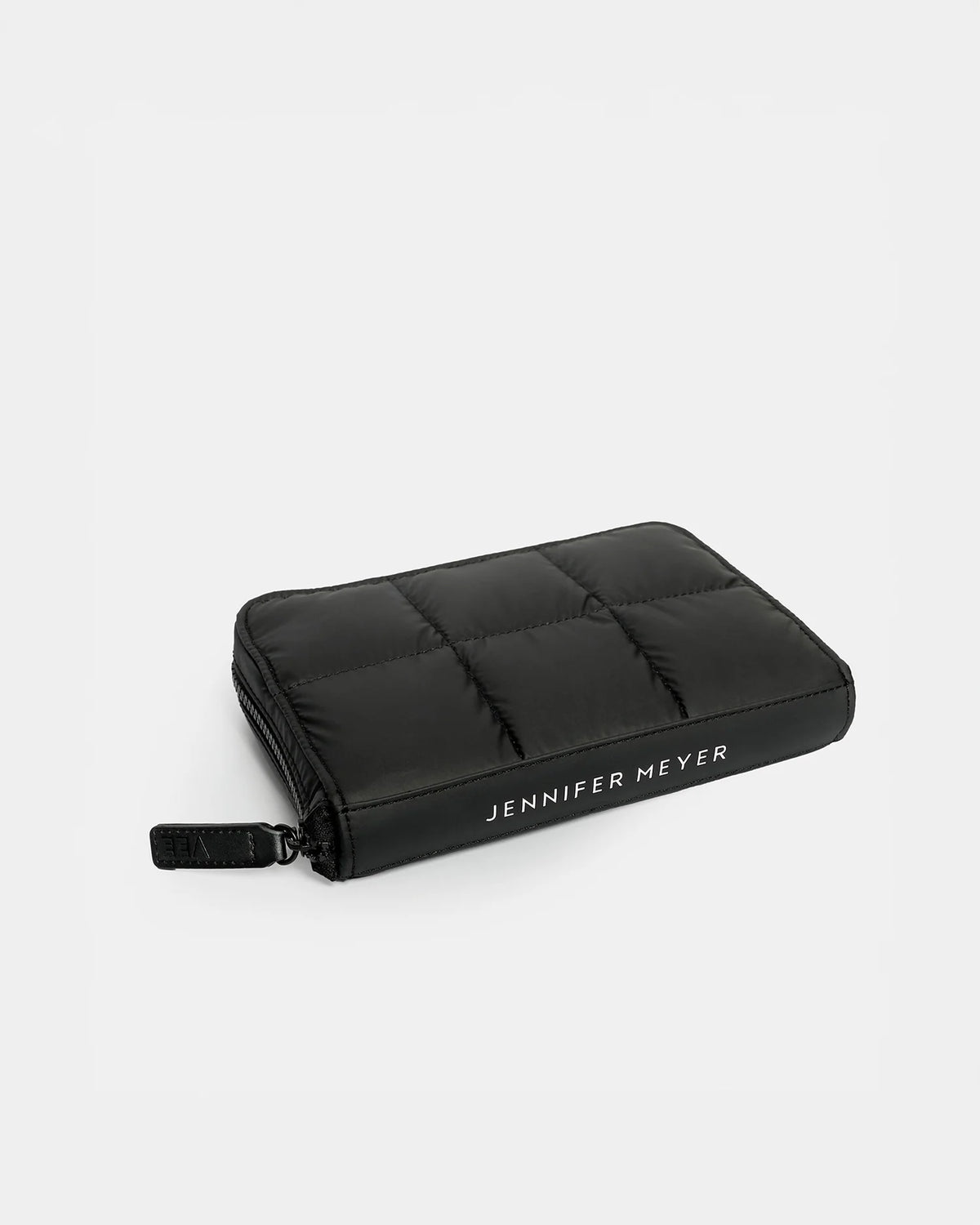 A sleek black quilted jewelry case featuring a zippered closure and the name JENNIFER MEYER embossed on the front. The design combines modern style with functionality, making it ideal for securely storing jewelry.
