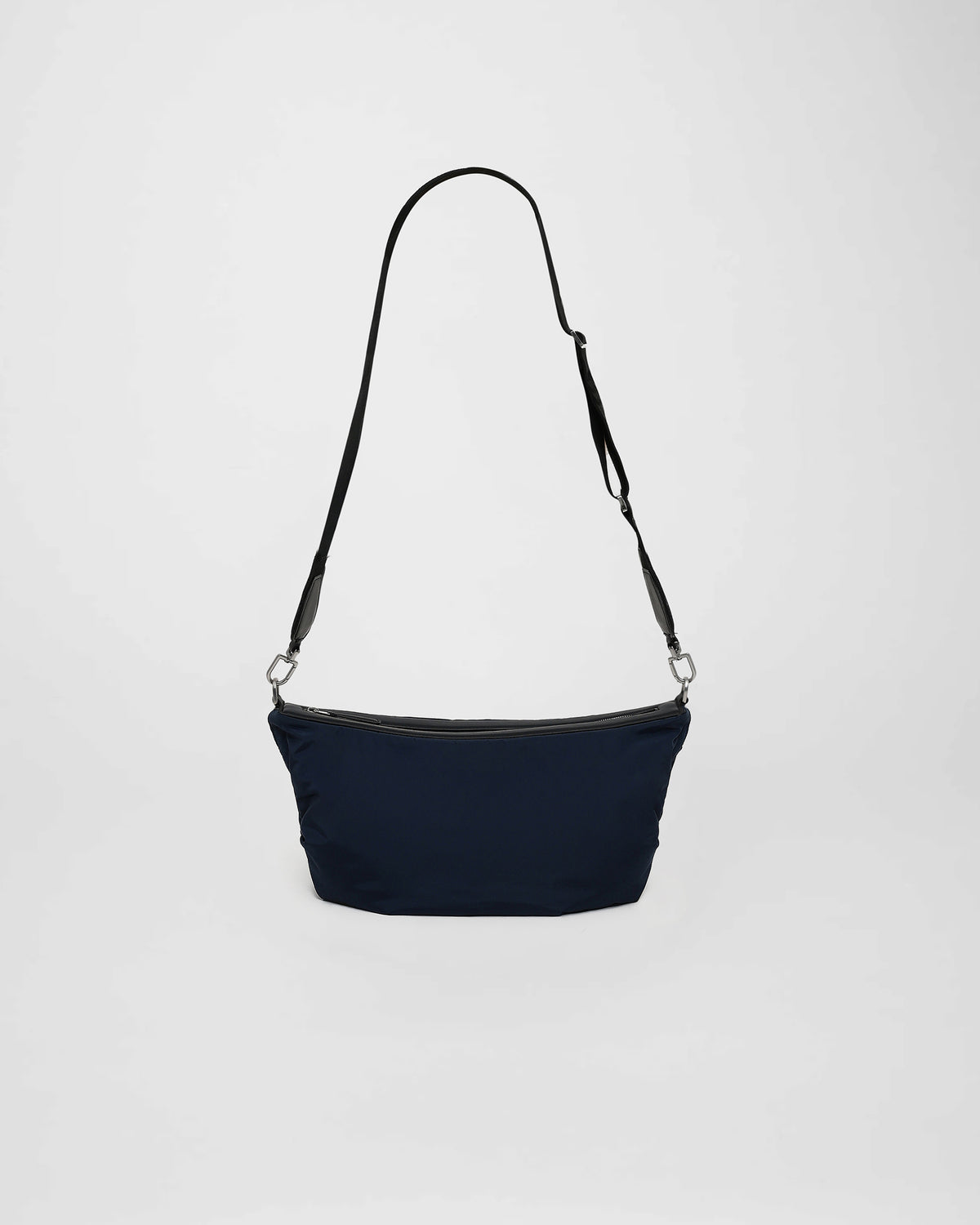 A front-view photo of a Caba Banana featuring a shoulder strap, displayed against a plain white background.