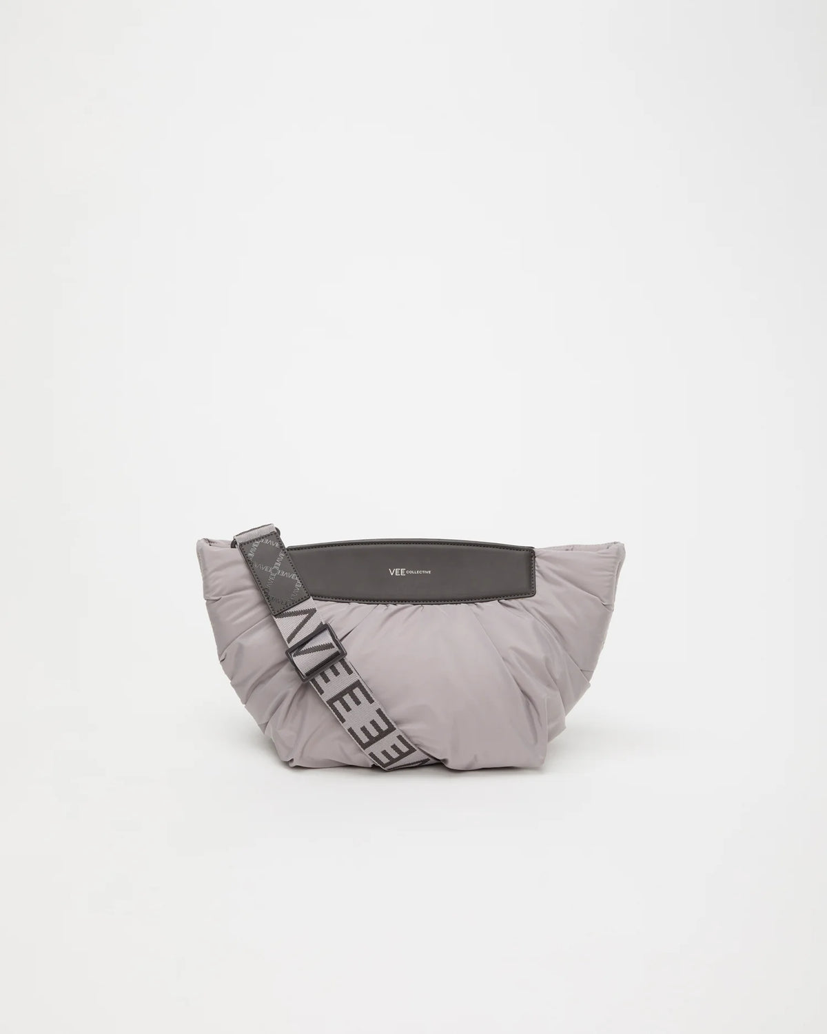 Front Image of the Caba Clutch Bag in Dove by Vee Collective, displayed with its strap.