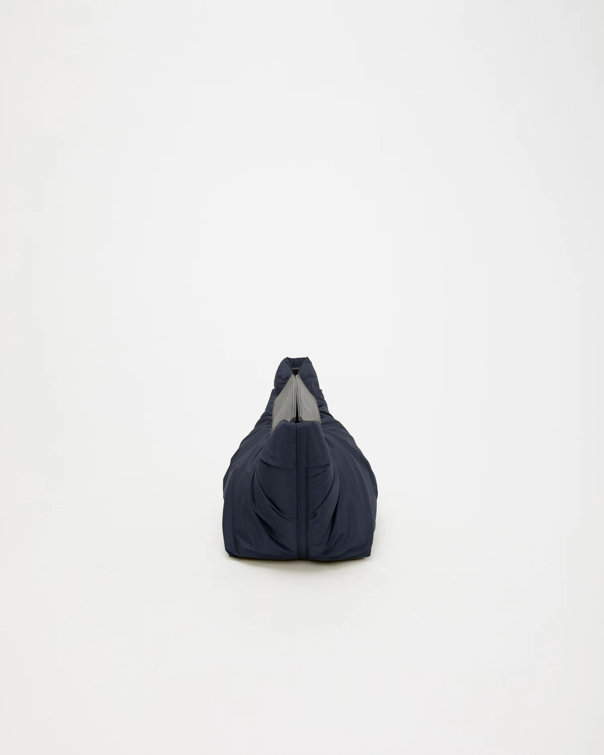 Side view product image of the Caba Clutch bag in Marine by Vee Collective.