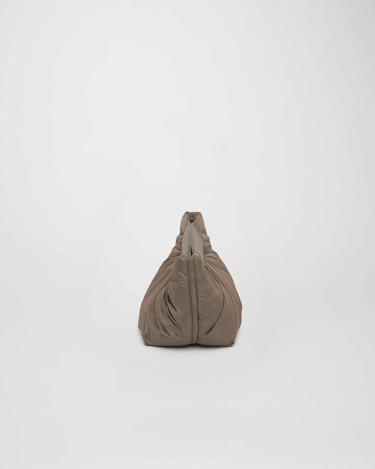 A photo of a Cabe clutch Bag featuring a silver-tone metal zipper, shown from a rear three-quarter view against a plain white background.