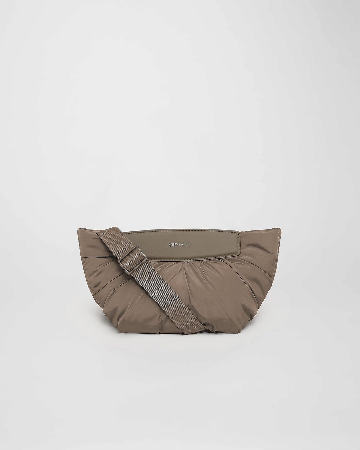 A front-view photo of a Caba clutch featuring a shoulder handle displayed against a plain white background.