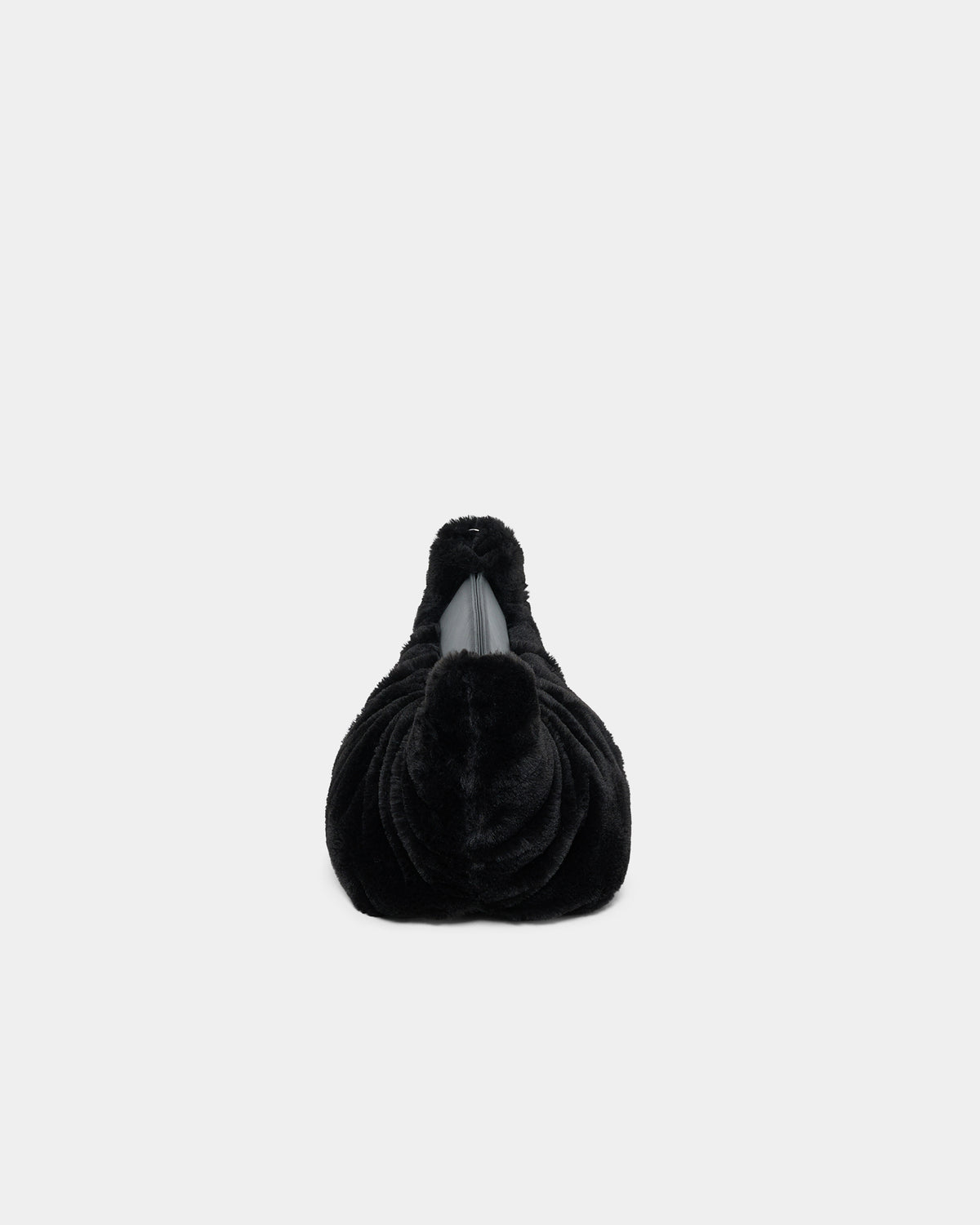 A clean side-view product photo of the Caba Fur Clutch, featuring a soft, fuzzy faux-fur texture against a crisp white background.