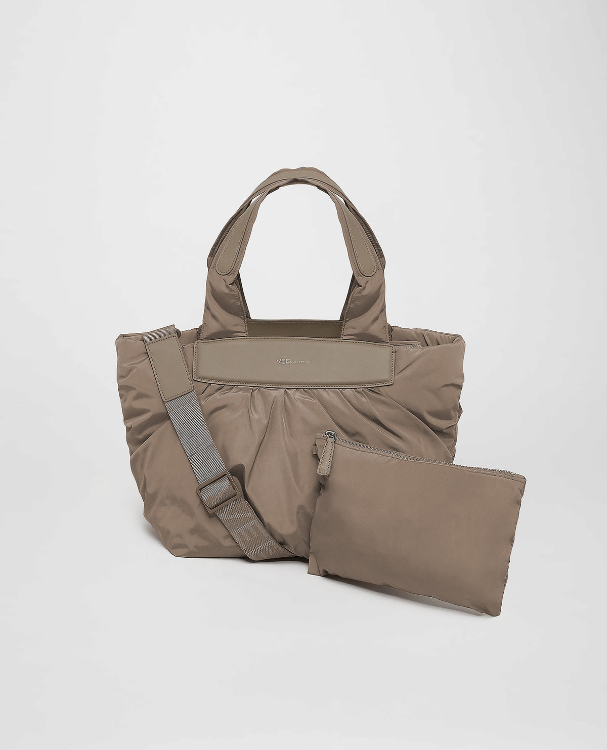 A photo of an Essence Marche featuring matching handles and shoulder straps, paired with a matching pouch, displayed against a plain white background.