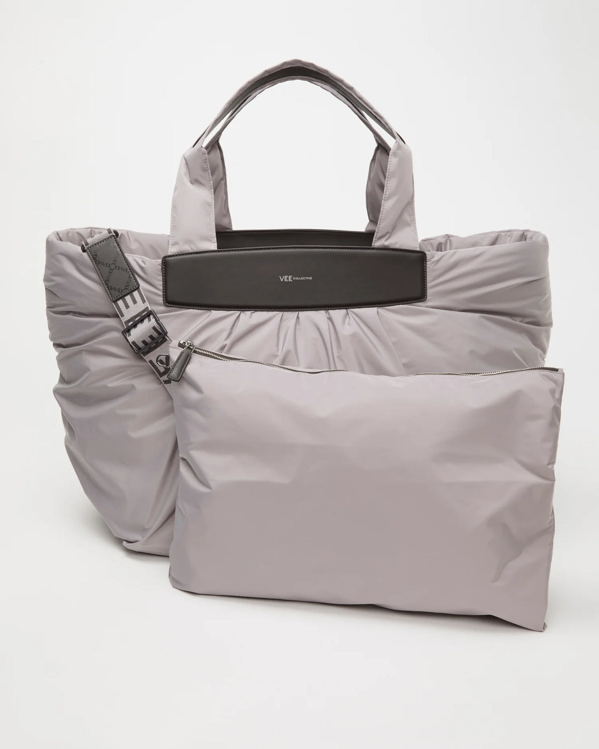 Front view of the Caba Weekender Tote Bag in Dove, shown with its matching pouch and detachable strap.