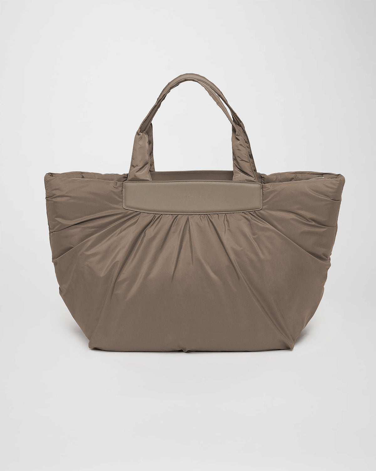 A front-view photo of a Caba Tote featuring two handles and trim, displayed against a plain white background.