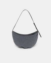 A clean product photo of a charcoal Essence Wool Banana Shoulder Bag featuring a black leather strap and zipper trim, photographed against a crisp white background.