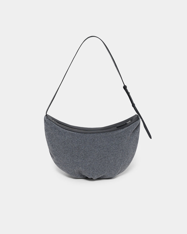 A clean product photo of a charcoal Essence Wool Banana Shoulder Bag featuring a black leather strap and zipper trim, photographed against a crisp white background.