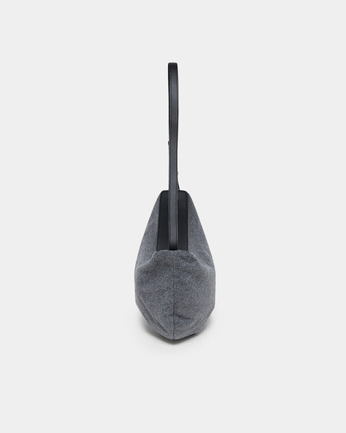 A product photo of the Essence Wool Banana bag shown from the side, featuring a zippered top and double shoulder straps, centered against a white background.