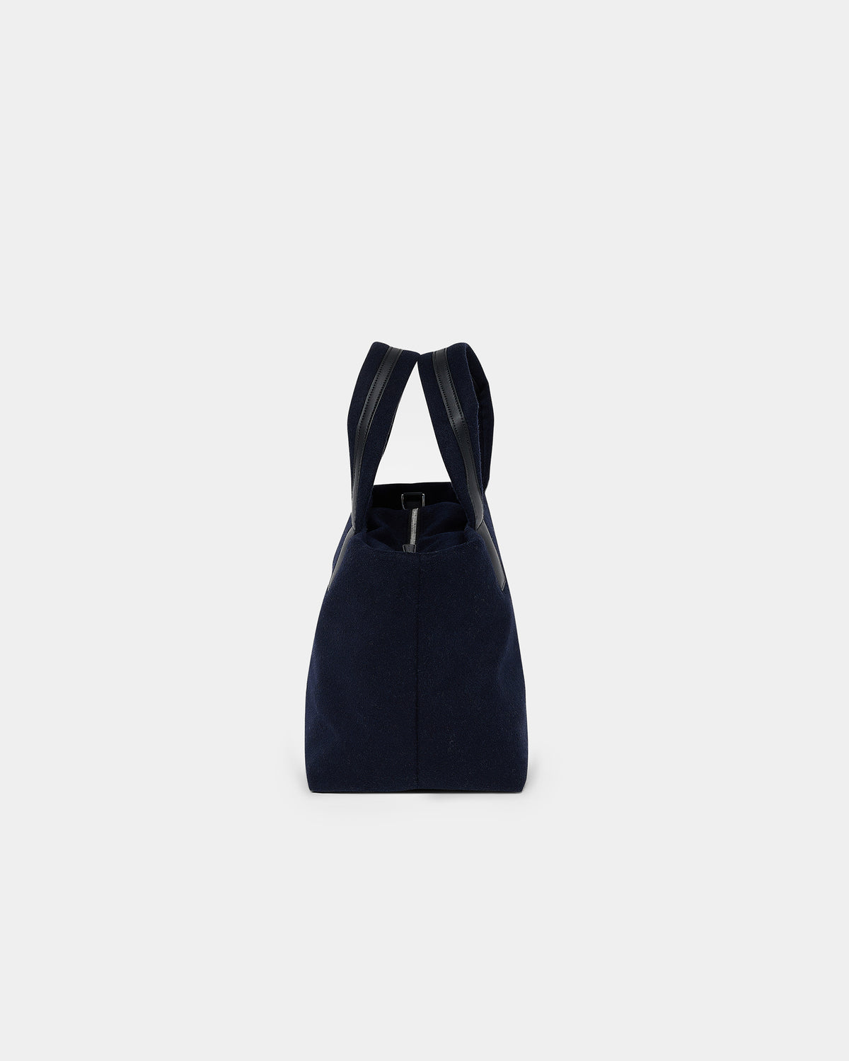 A product photo of the Essence Wool Tote bag shown from the side, featuring a zippered top and double shoulder straps, centered against a white background.