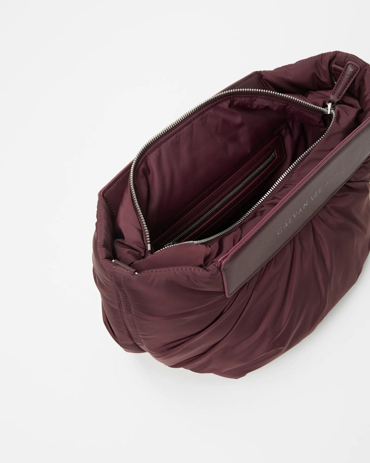 Galvan x Vee Collective Caba Clutch Bag in mahogany, shown slightly angled and open, photographed from a slightly overhead perspective.