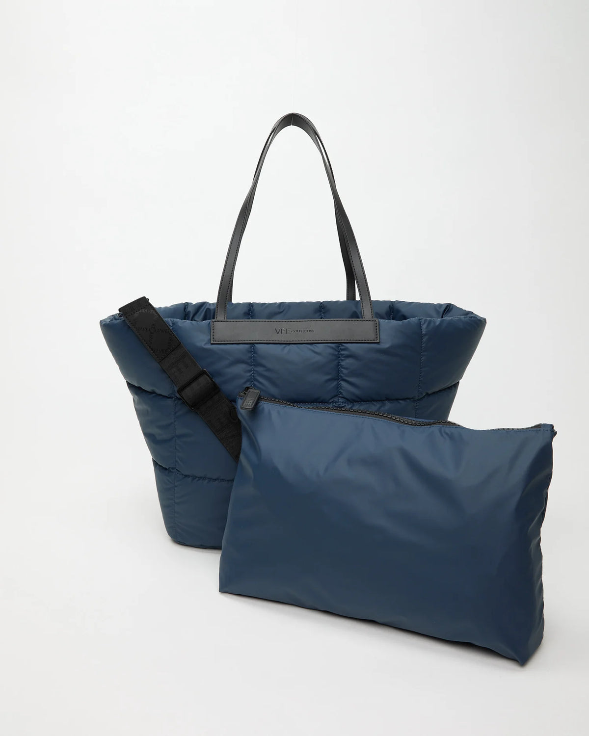 Blue tote bag with a shoulder strap and matching pouch on a white background