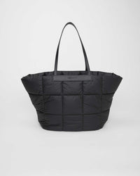 Large lightweight tote, sustainable, and waterproof. Perfect for gym sessions, moms, work, and travel, combining style with practical versatility.