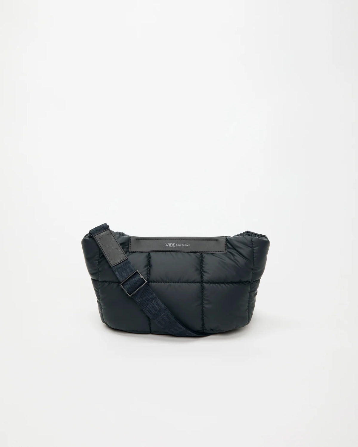 Front Image of the Porter Basque Clutch Bag in Dark Navy by Vee Collective, displayed with its strap.