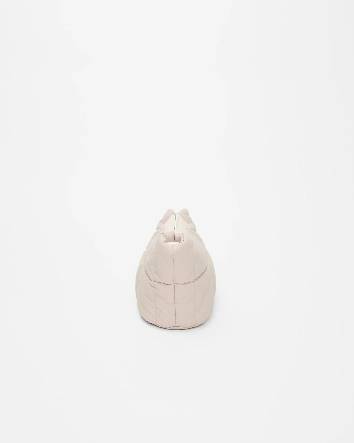 Side view product image of the Porter Basque clutch bag in Soft Taupe by Vee Collective.