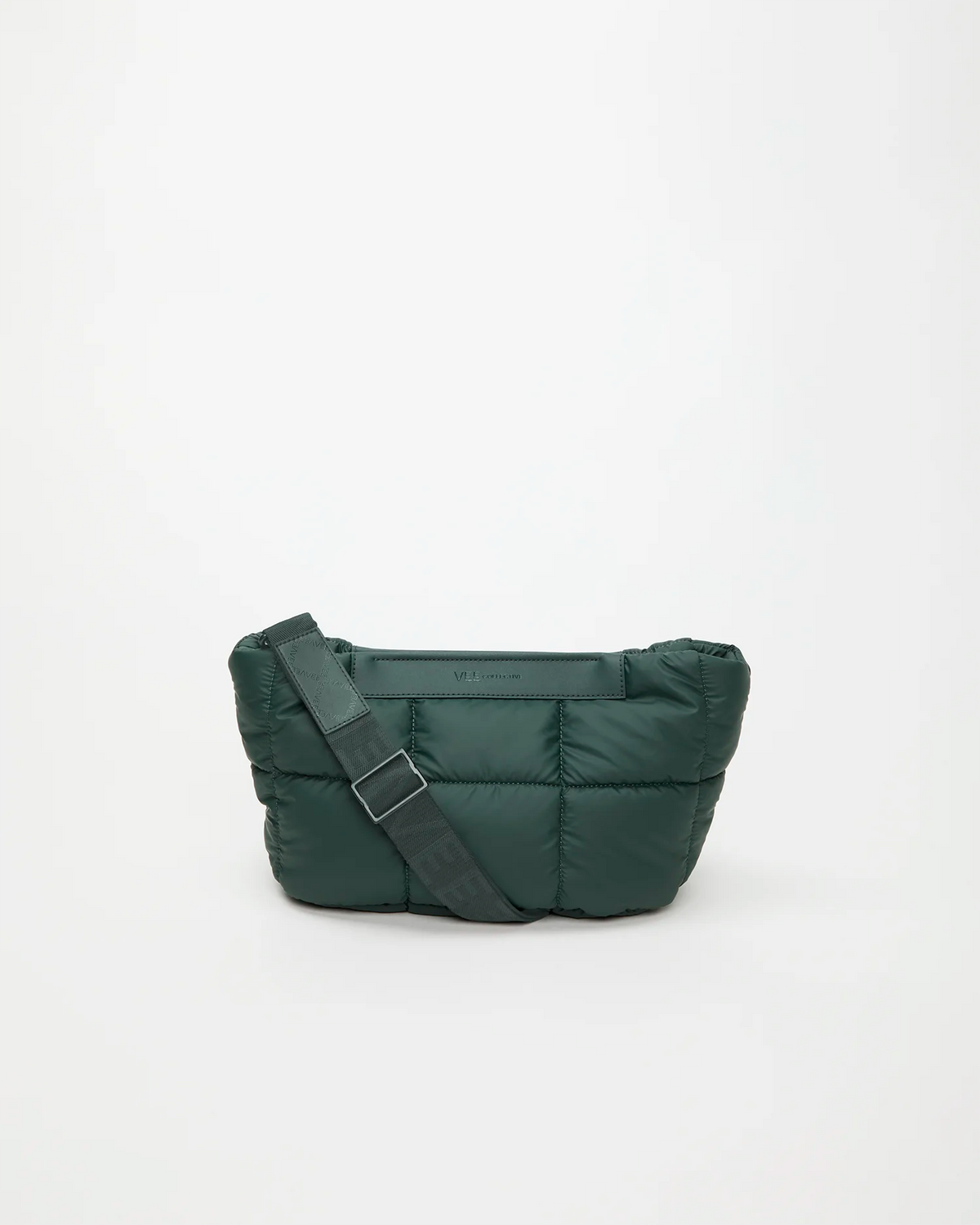 Product picture of the Porter Basque clutch by Vee Collective in bottle green, featuring a quilted puffer design and an adjustable shoulder strap.