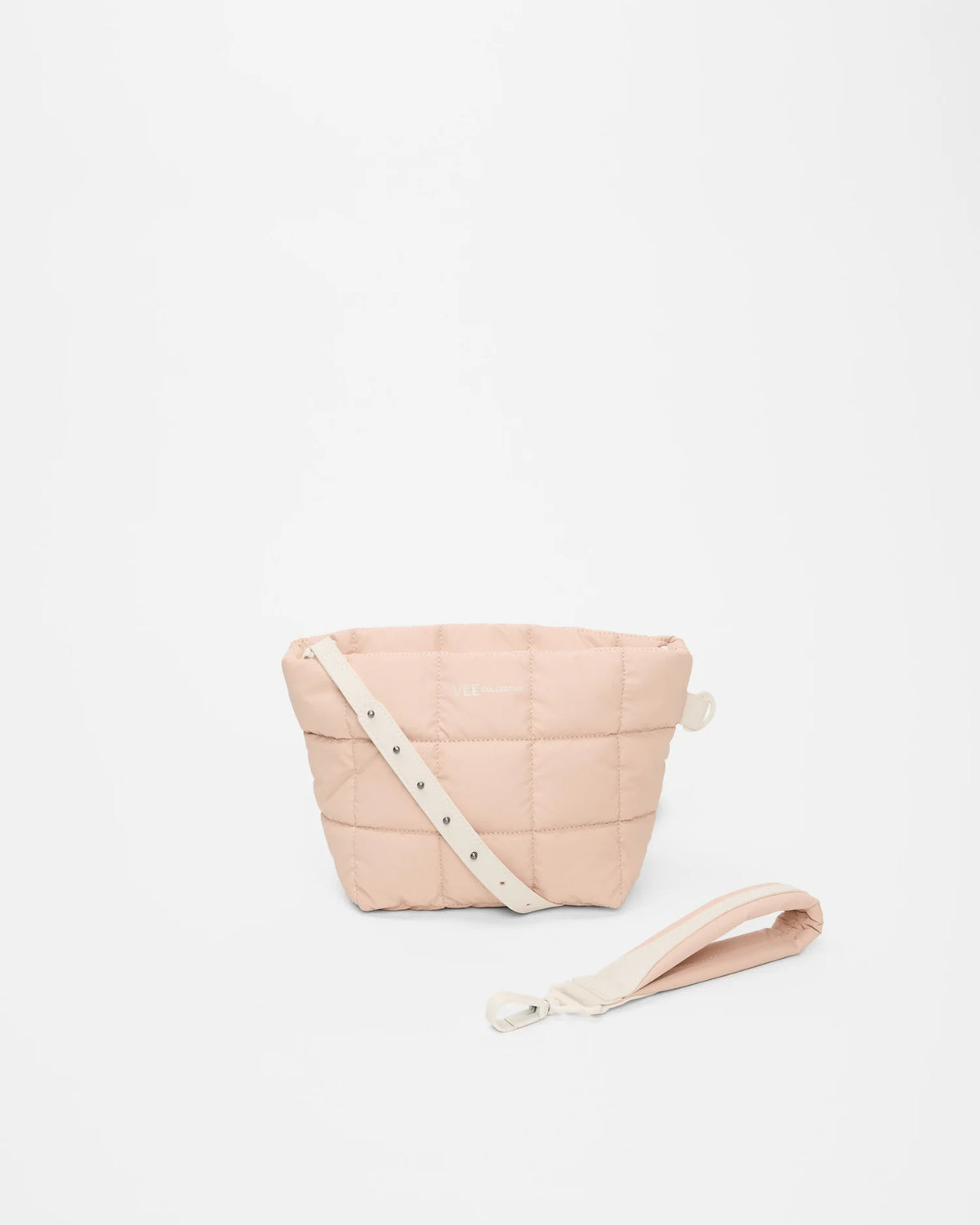 Front view of the Porter Clutch Bag in Cameo Rose by Vee Collective, shown with the attachable wristlet and the attachable strap.