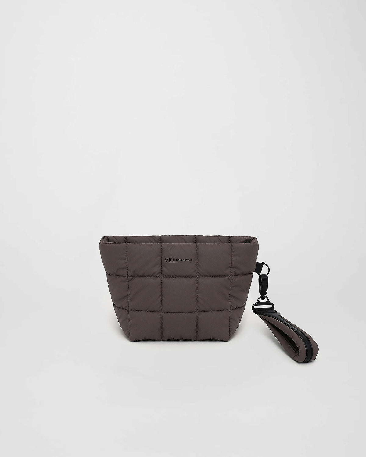 A front-view photo of a mink Porter Clutch bag with a matching wristlet strap, displayed against a clean white background.