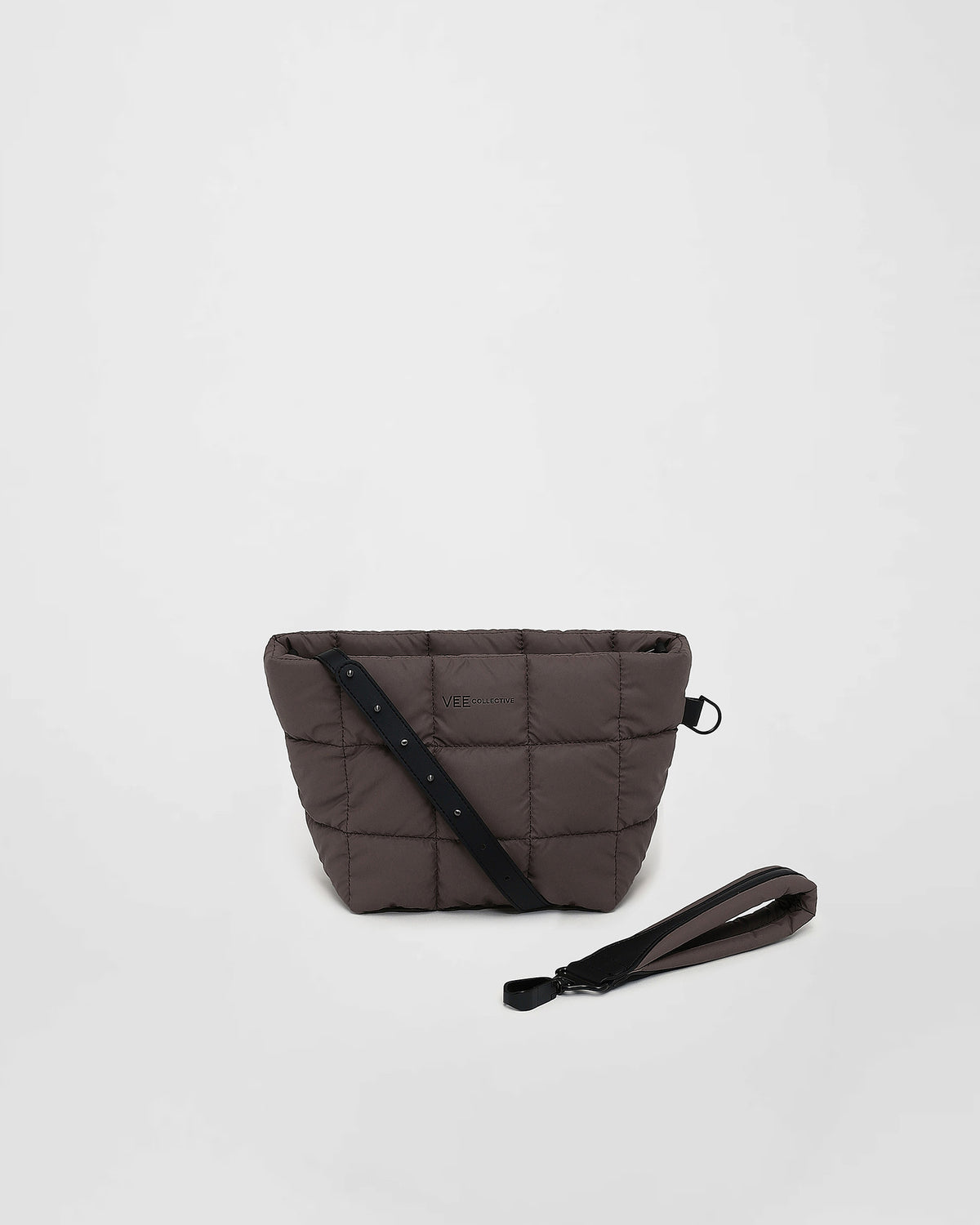 A front-view photo of a mink Porter Clutch bag with a matching wristlet strap, displayed against a clean white background.