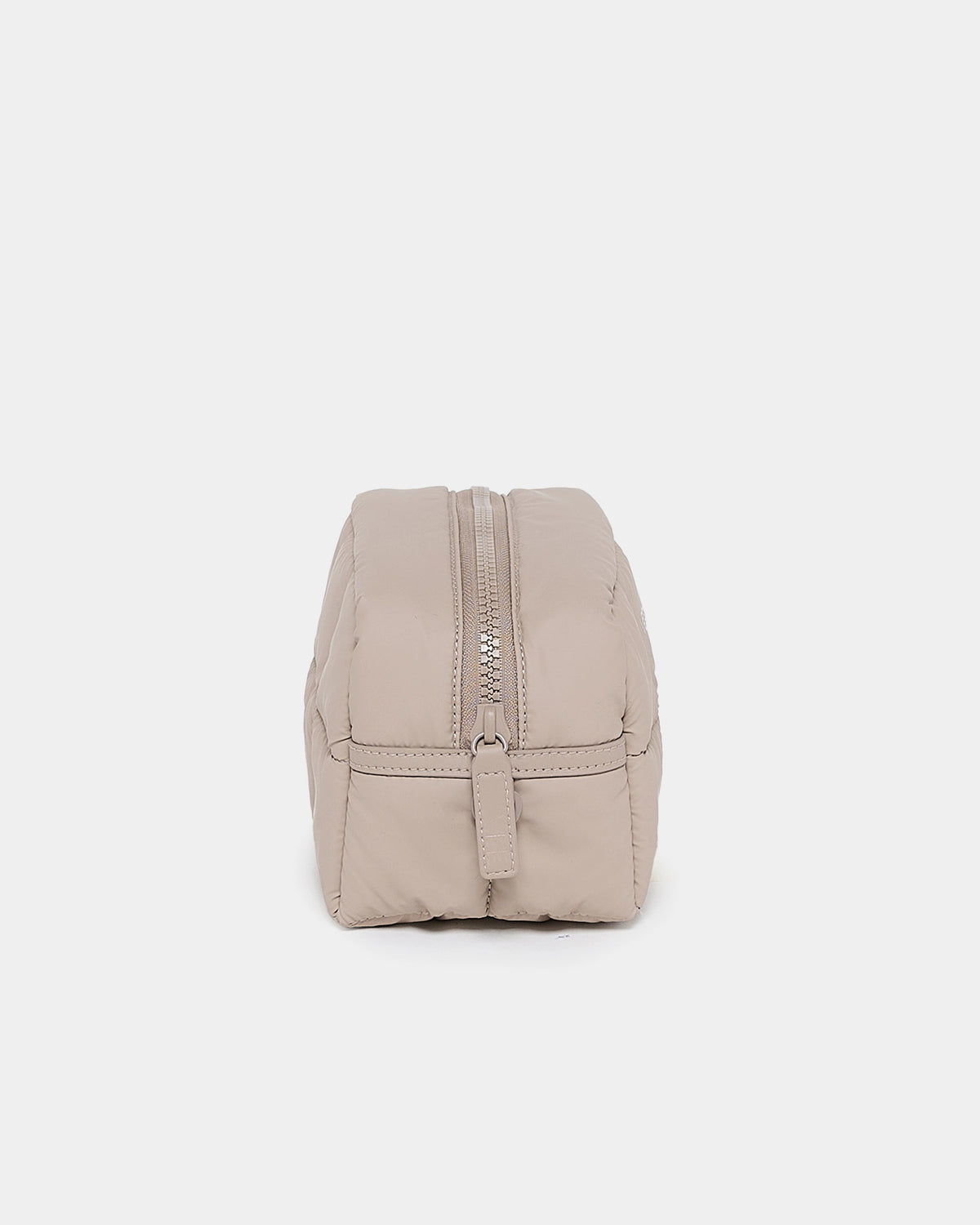 Beige padded compact backpack from The Organizer Duo in Neutral showing the top zipper