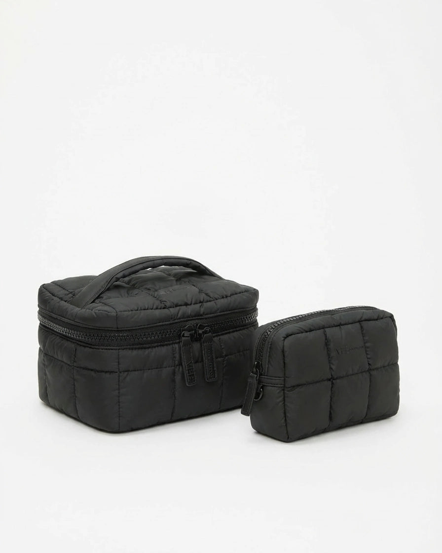The Organizer Duo in Black featuring a large quilted bag and a coordinating zip pouch.