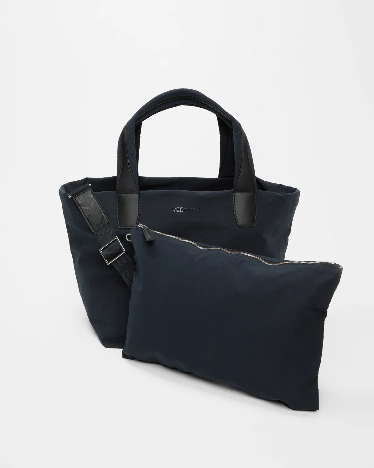 Front view of the Medium Porter Essence Tote Bag in Midnight Trench, shown with its matching pouch and detachable strap.