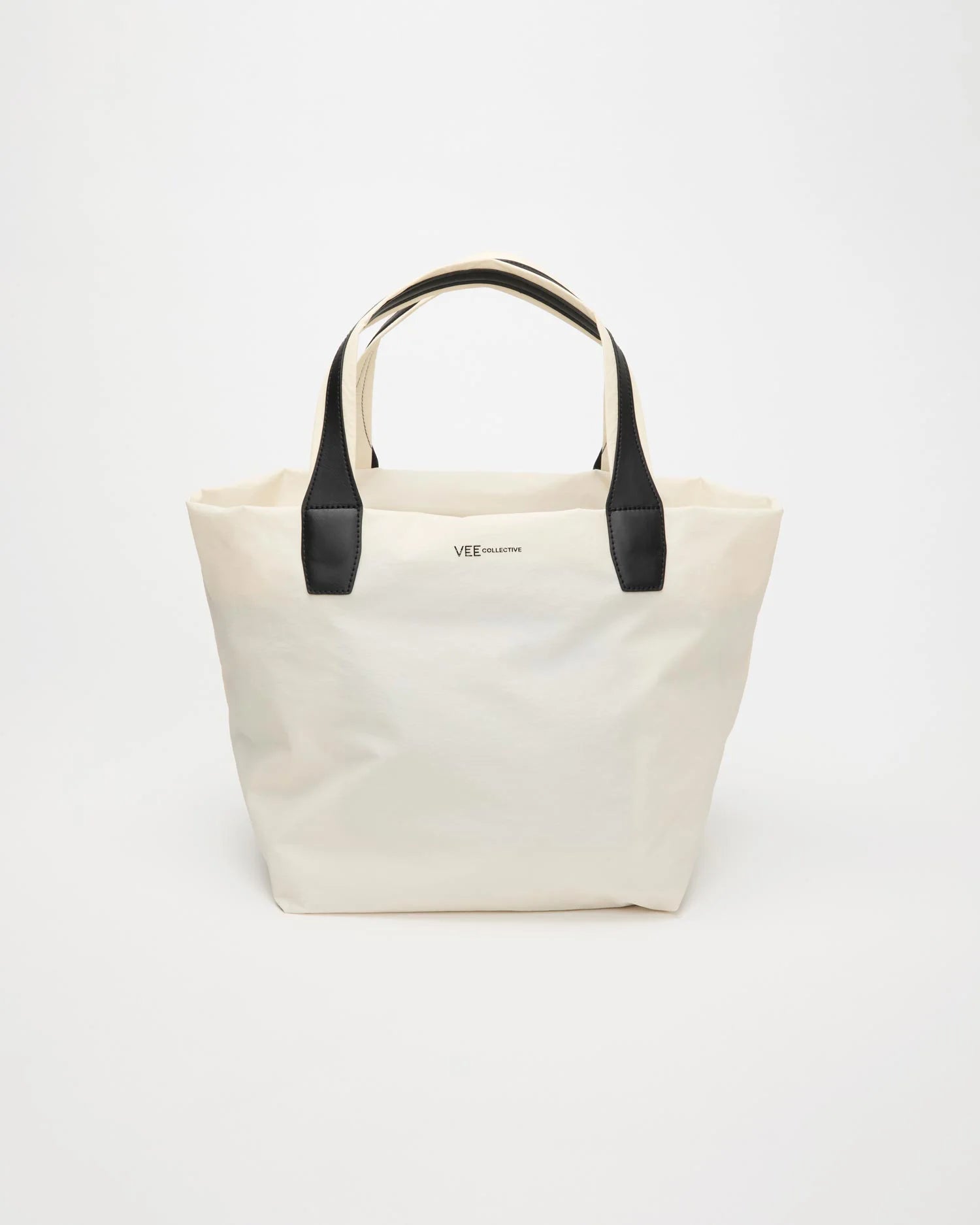 Front product image of the Vee Collective Porter Essence Medium Tote Bag in off-white, showing its clean, structured tote silhouette.