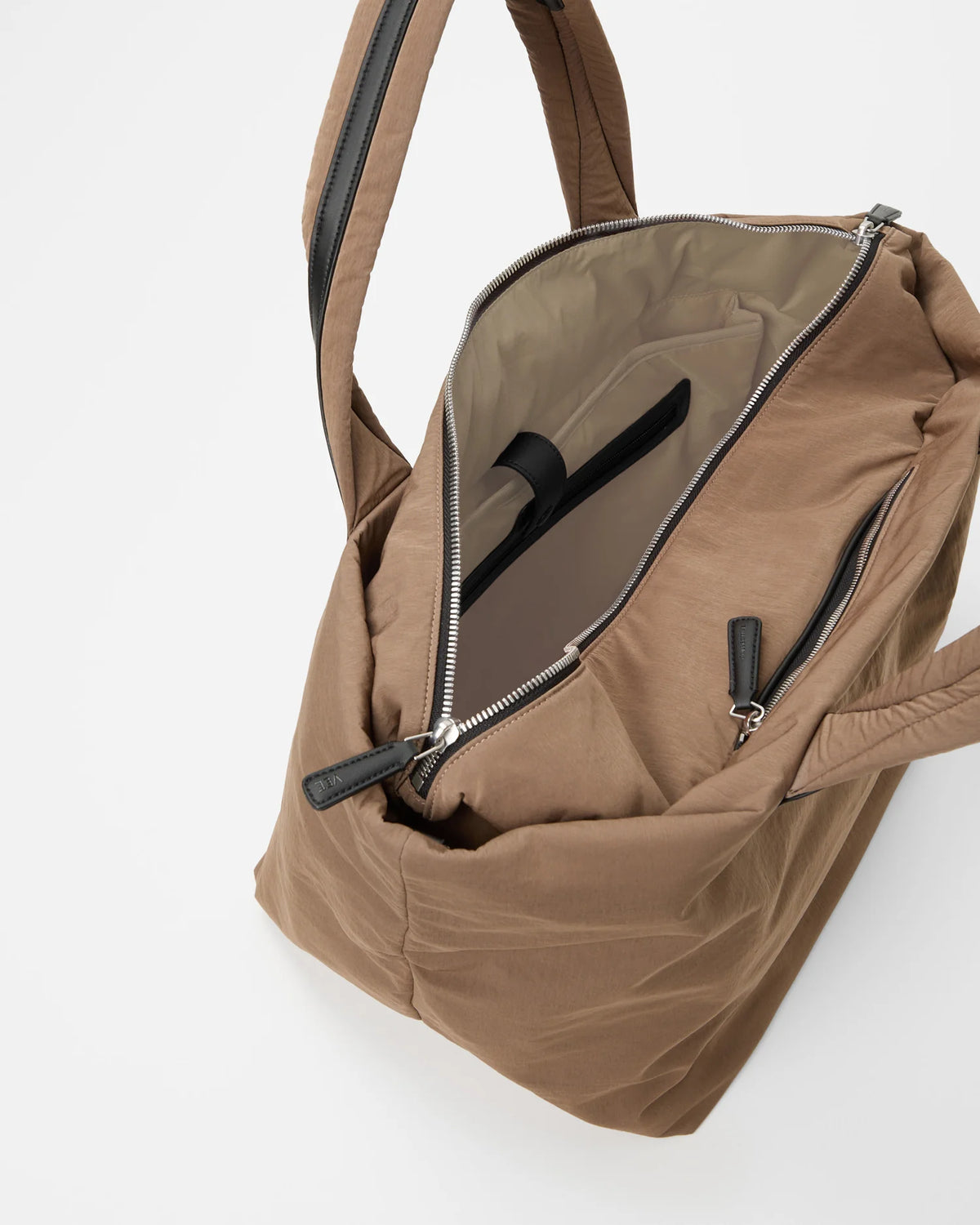 Essence Tote Medium Mink Trench, zipper open revealing light beige lining and inner pocket.