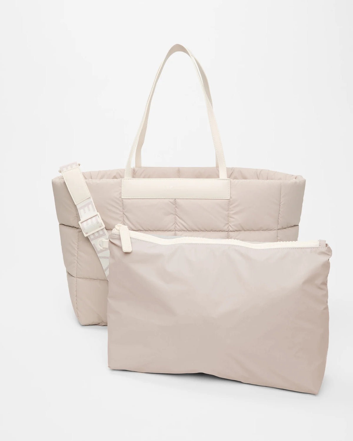 Front view of the Vee Collective Porter Marché Bag Large in Soft Taupe, shown with a matching pouch and detachable shoulder strap.