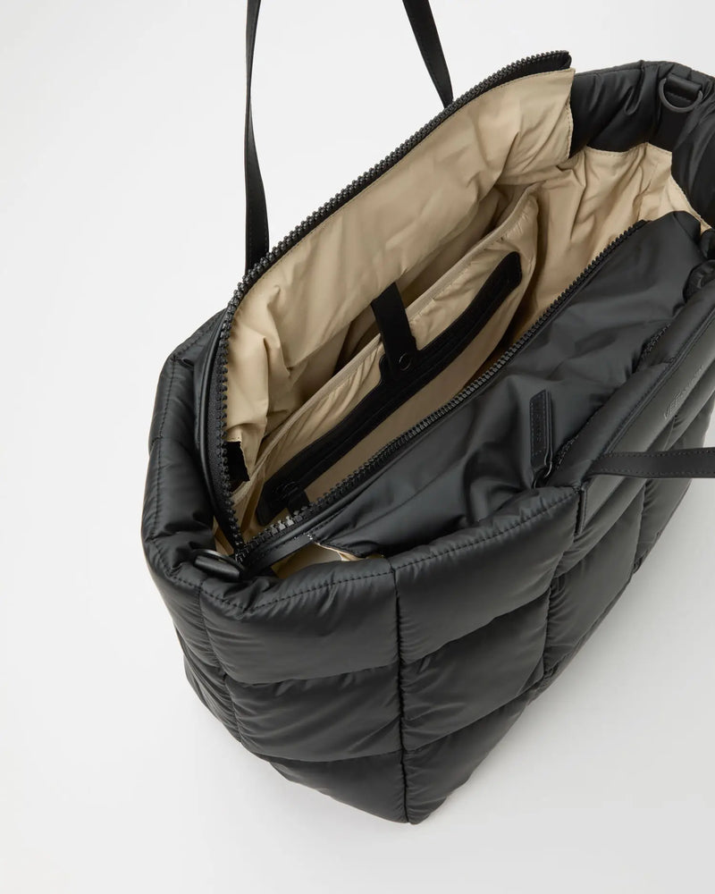 Porter Marché Large Matt Black bag open to show beige interior with multiple pockets and divider.