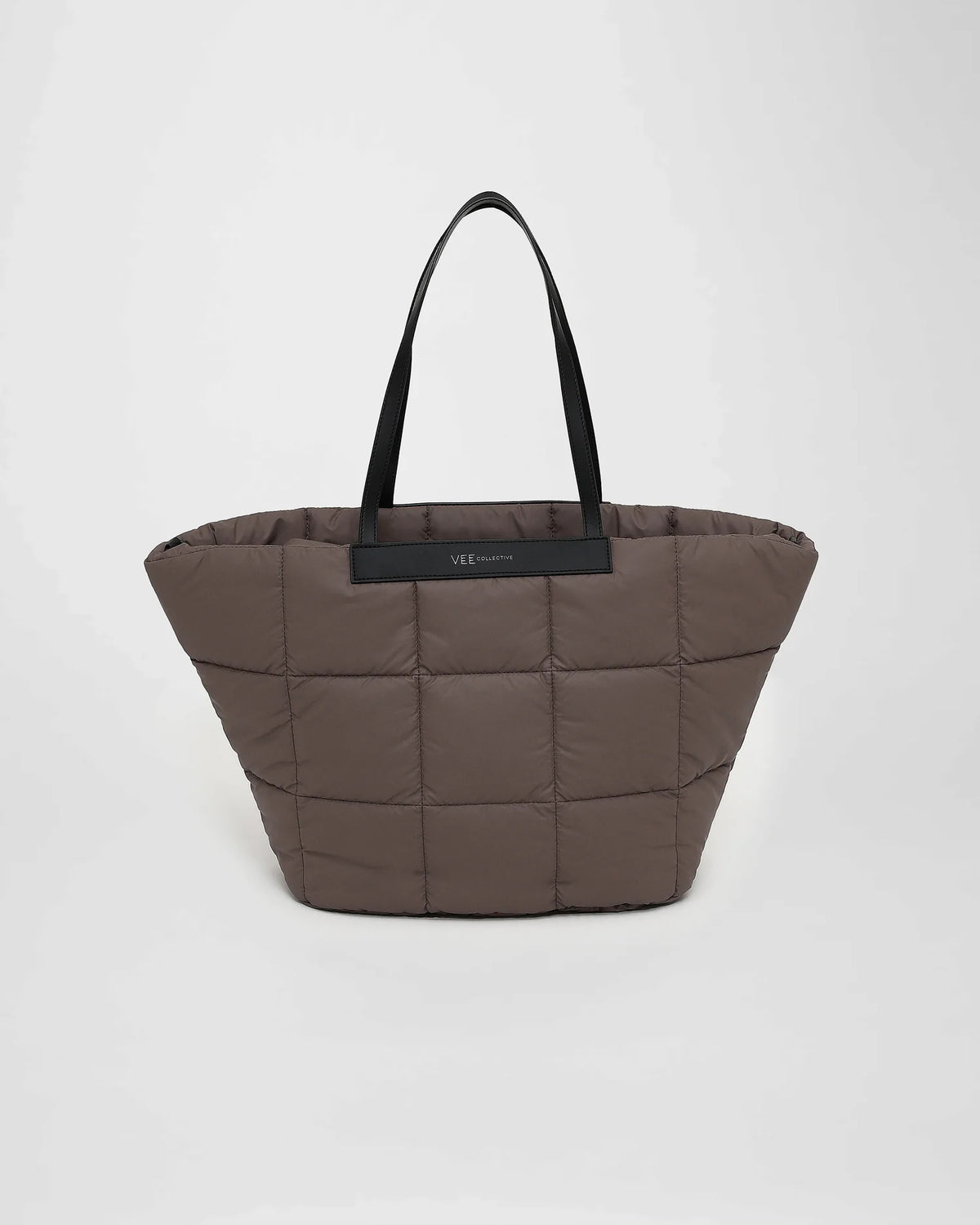 A picture featuring the front view of a Porter Marche Bag medium in mink with black handles on a white background.