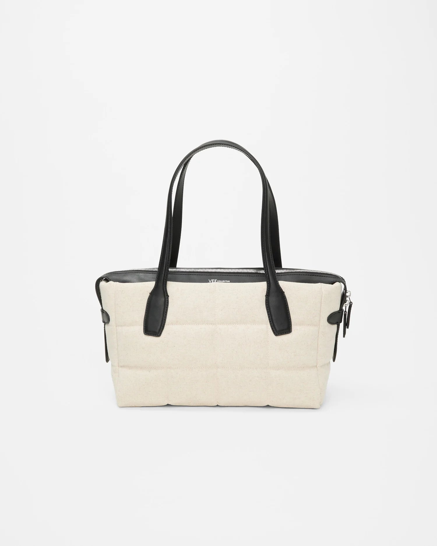 Tela Tote Small Natural canvas bag with black leather handles and a top zipper.