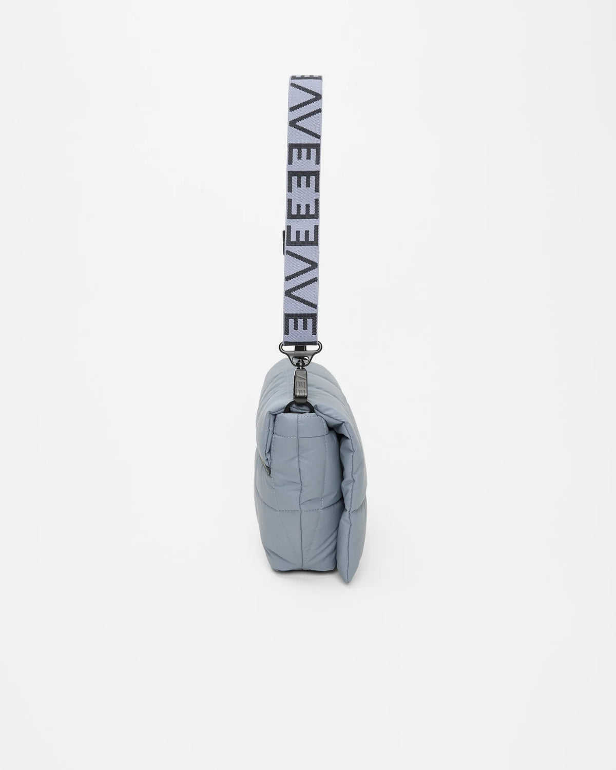 Side view product photo of the Porter Messenger Bag in slate grey by Vee Collective, shown closed, designed as a crossbody bag.