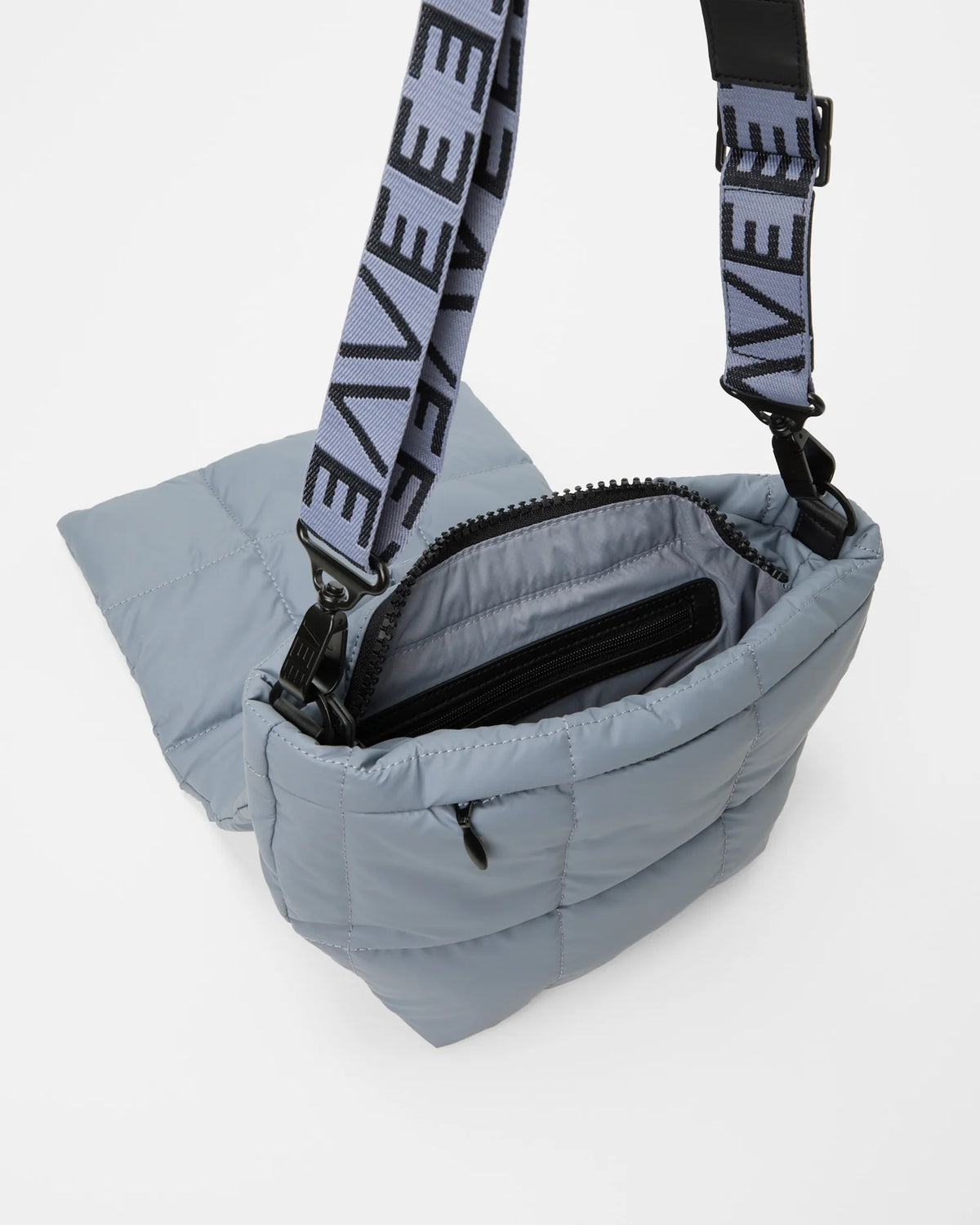 Angled product photo of the Porter Messenger Bag in slate grey by Vee Collective, shown open.