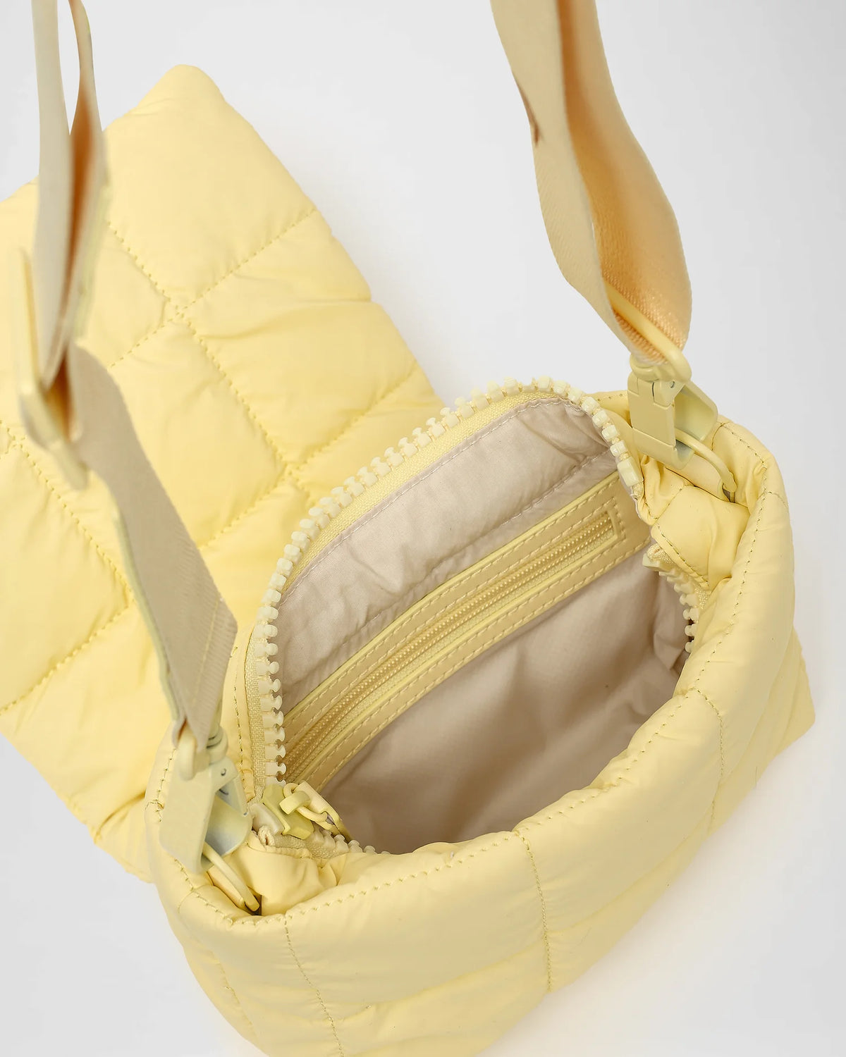 A close-up view of an open Porter Messenger Bag with a visible zipper and interior on a white background.