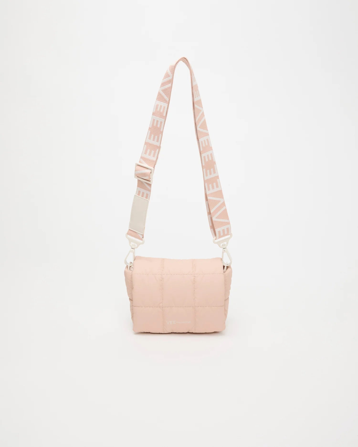 Front view of the Porter Messenger Mini Bag in Cameo Rose by Vee Collective, displayed with its strap.