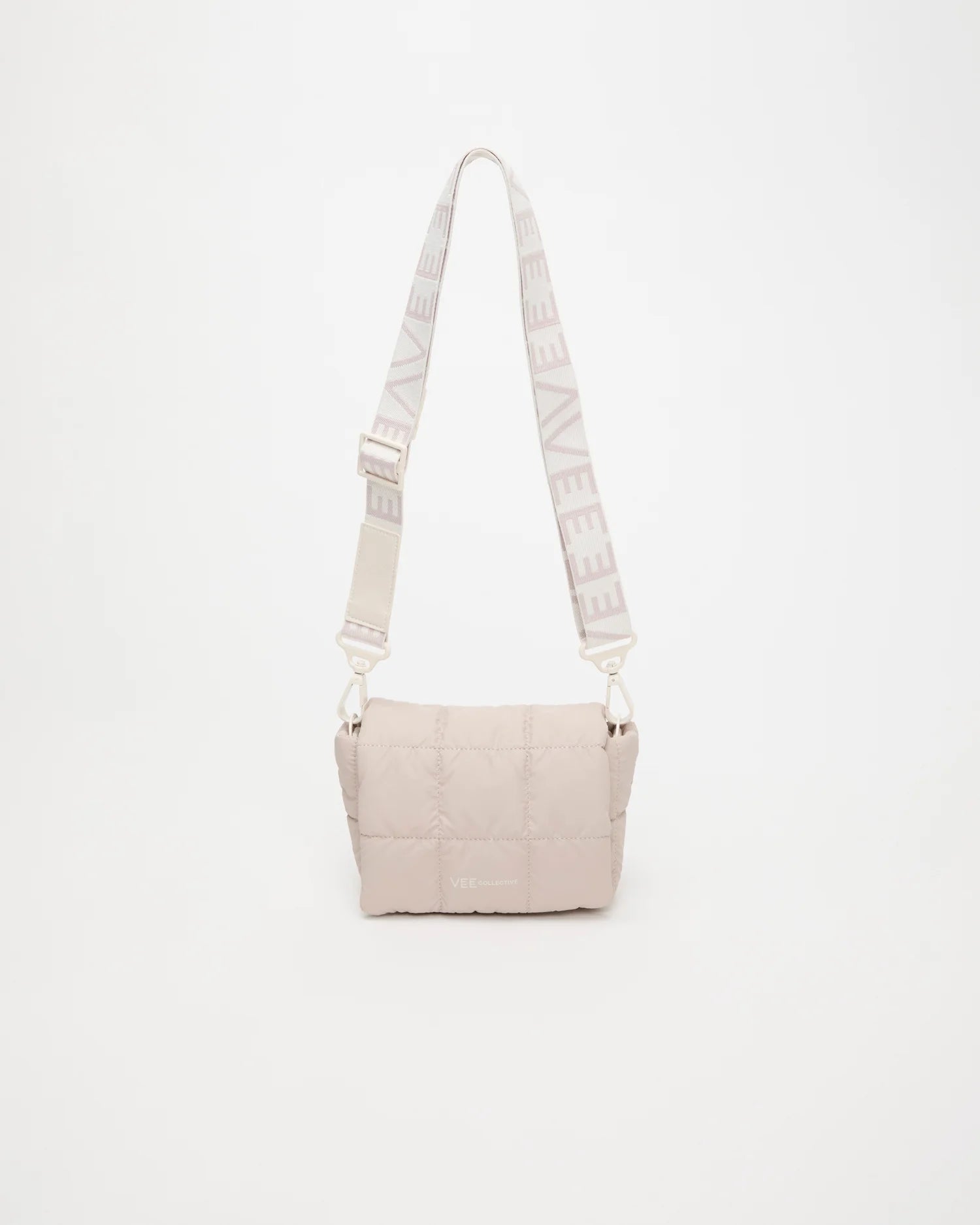 Front view of the Porter Messenger Mini Bag in Barely Beige by Vee Collective, displayed with its strap.