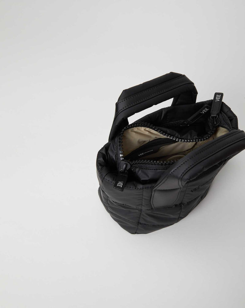 Porter Tote Mini Matt Black compact quilted tote with top handle and beige interior lining visible at the opening.