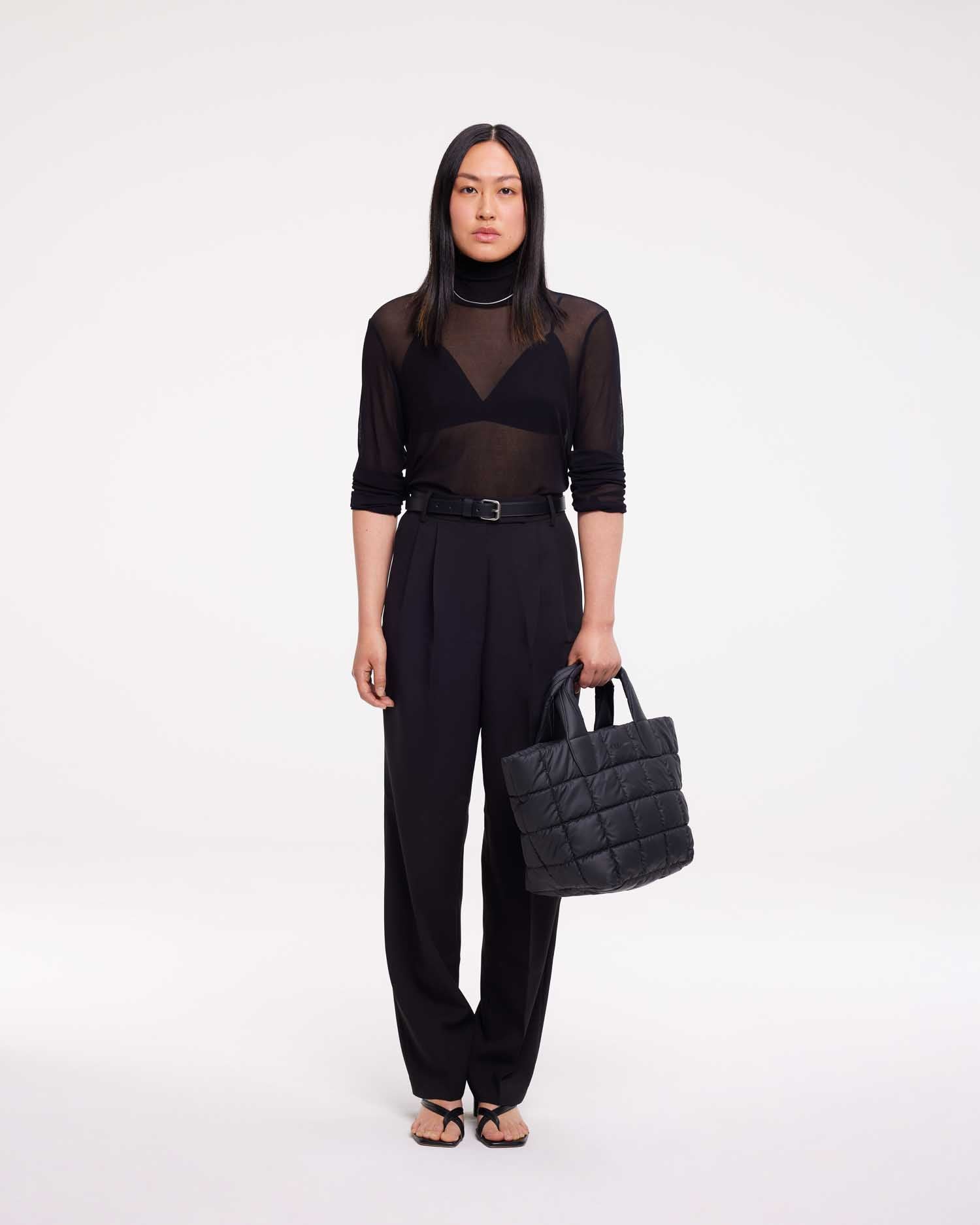 Small tote bag made from waterproof and sustainable materials, designed for versatility and durability. Ideal for work and everyday use, combining practical functionality with eco-friendly style in a compact design.