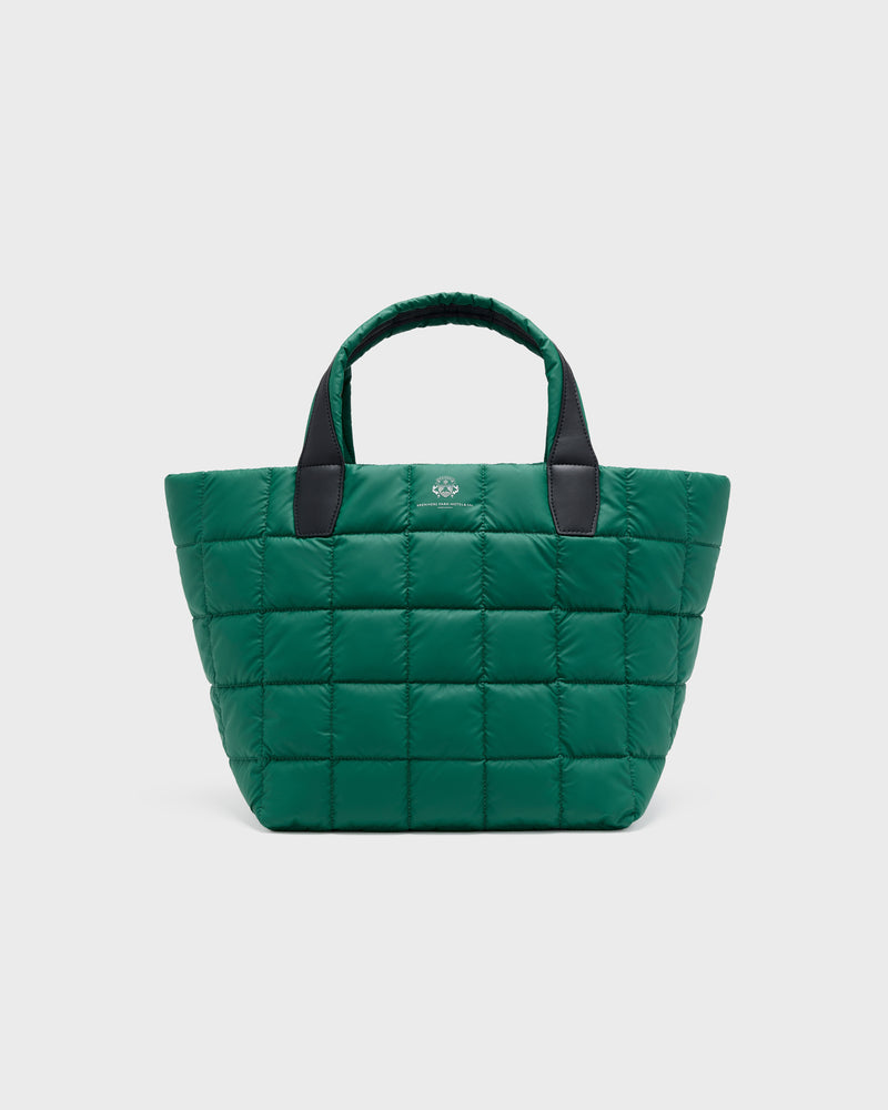 A green quilted puffer tote bag with black handles and a small silver logo on the front, set against a light gray background.